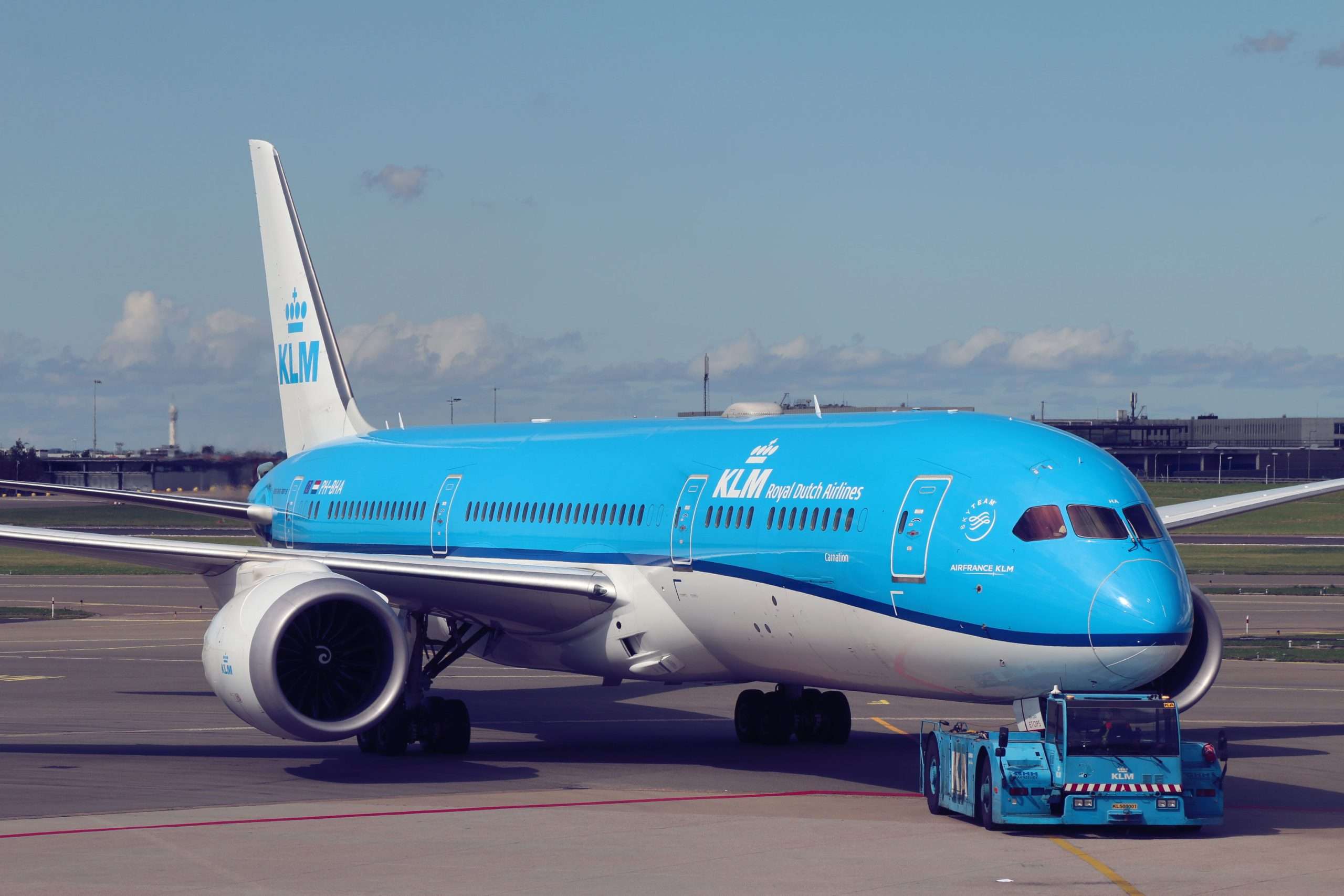 The company tugs gets to pushback the original Dutch dreamliner, KLM Boeing 787 PH-BHA "Carnation / Anjer "
