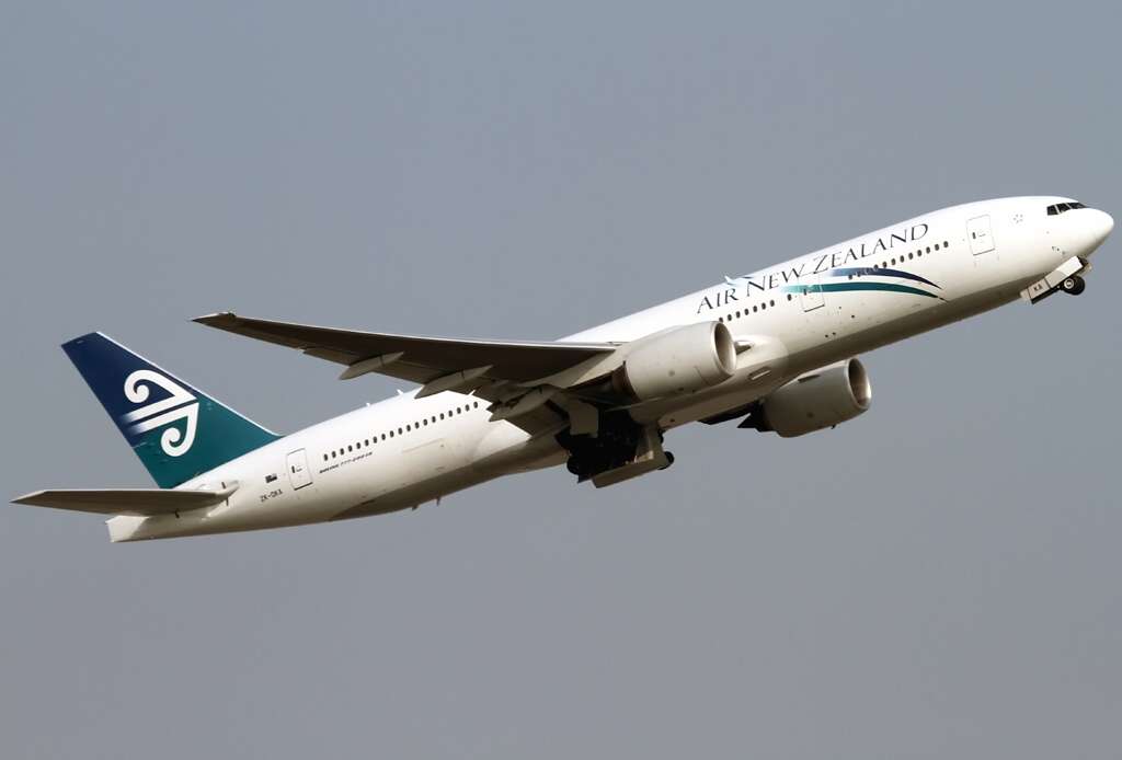 Air New Zealand's first Triple 7, delivered on 27 Oct 2005, climbs as flight NZ39 to London/LHR into the blue sky after a runway 07R departure.
