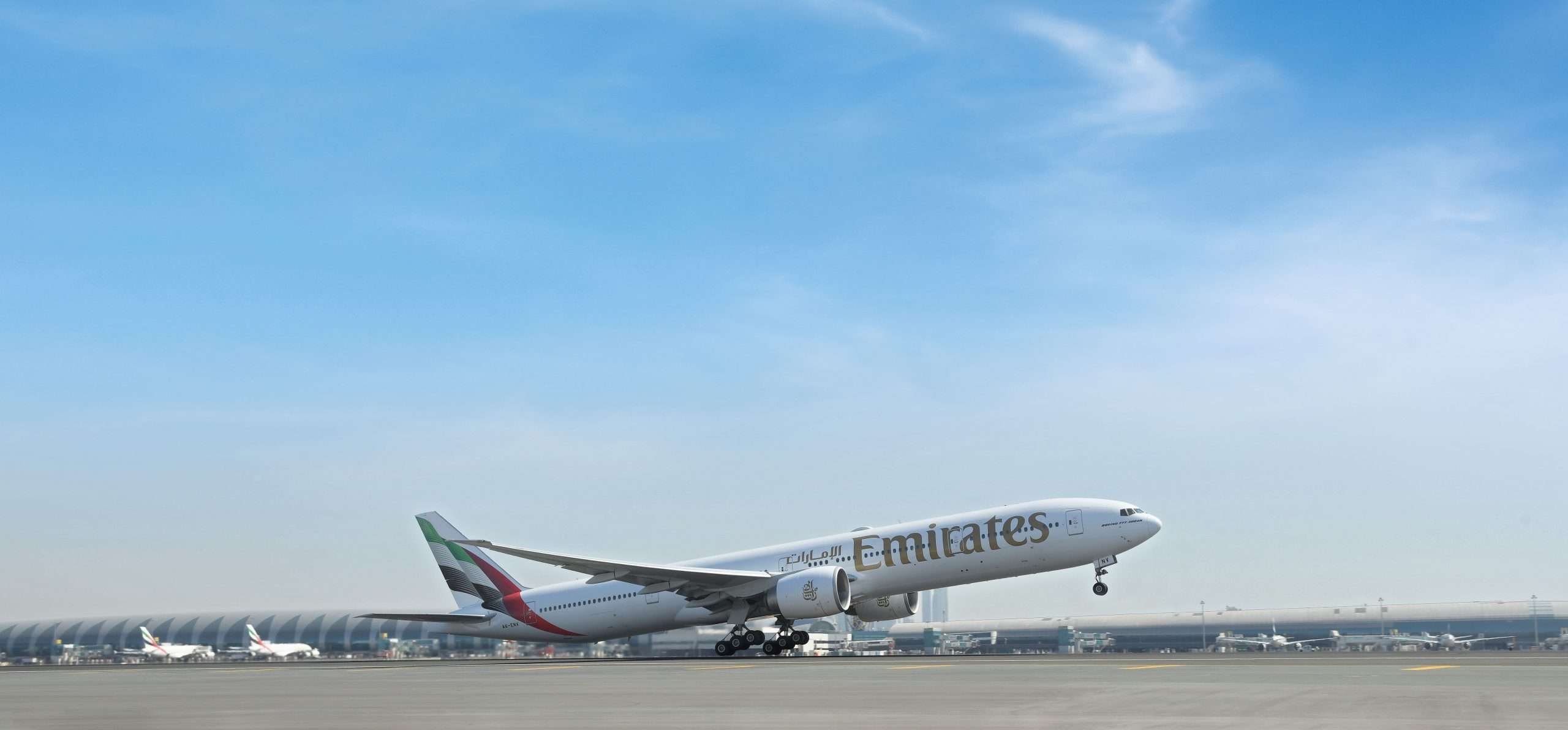 Emirates Boeing 777-300er departing in the new livery
