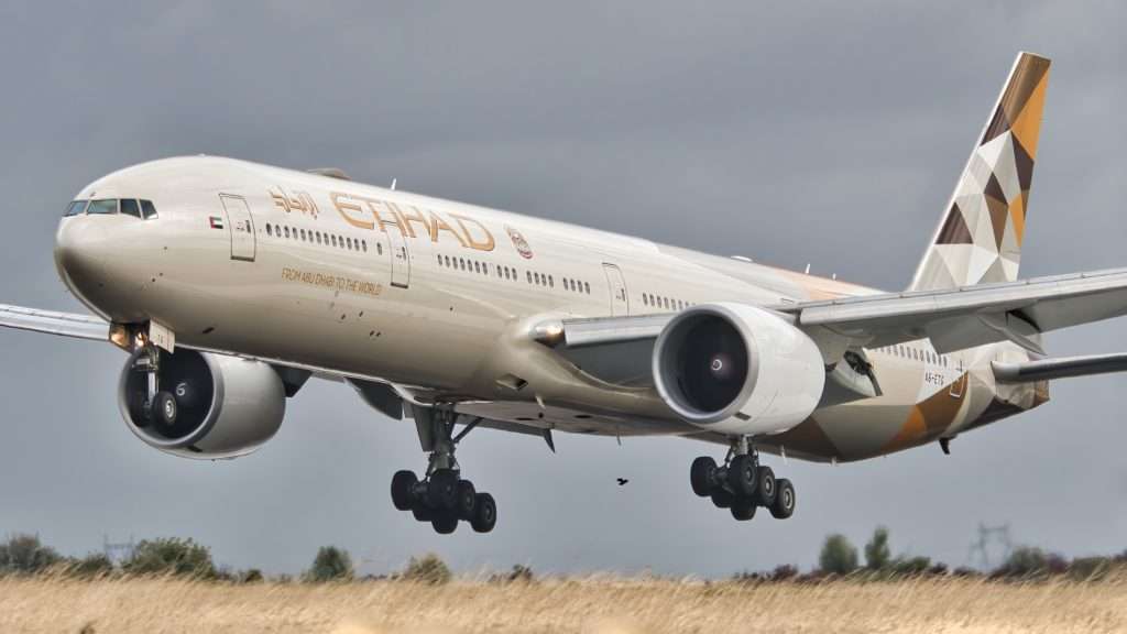 An Etihad Airways Boeing 777-300ER getting ready to touchdown.