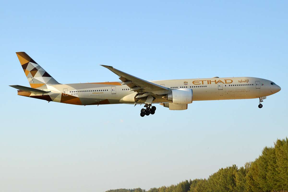 An Etihad Airways Boeing 777-300ER arriving into Phuket International Airport