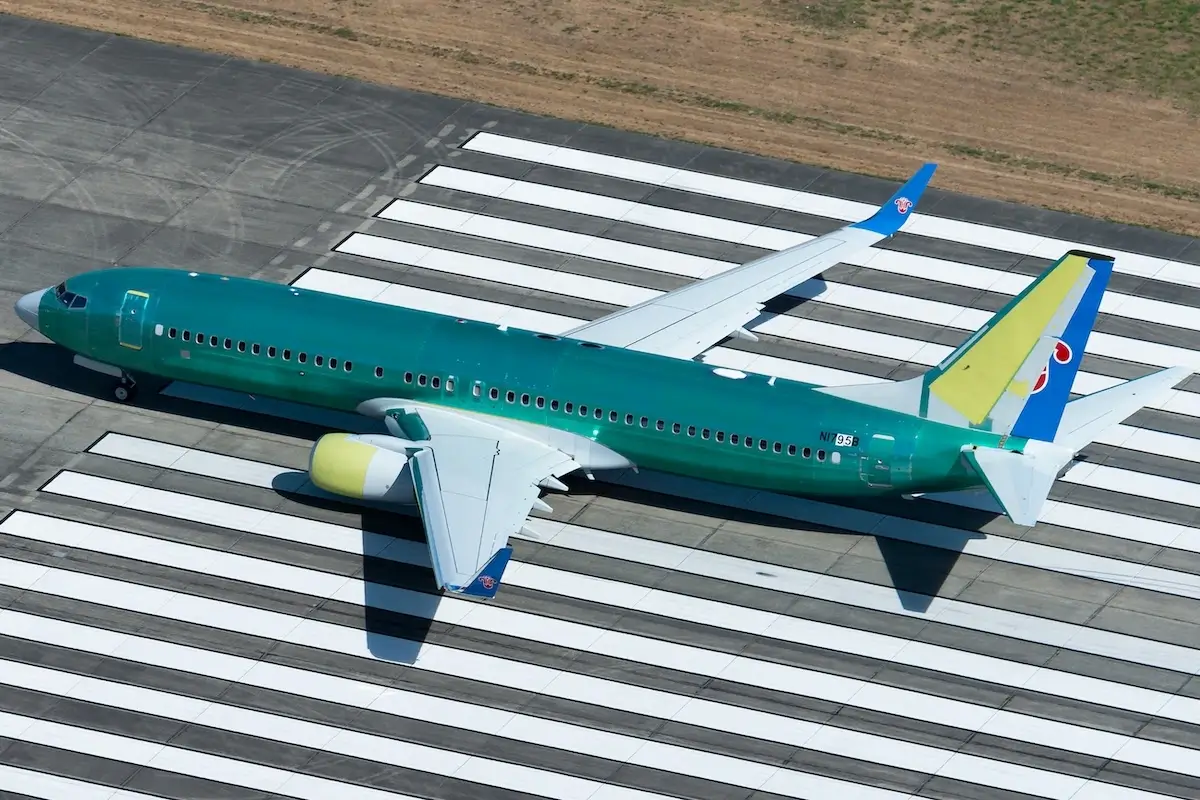 Aerial view of Boeing 737 NG doing some flight tests in the runway near the company factory at Renton Airport.
