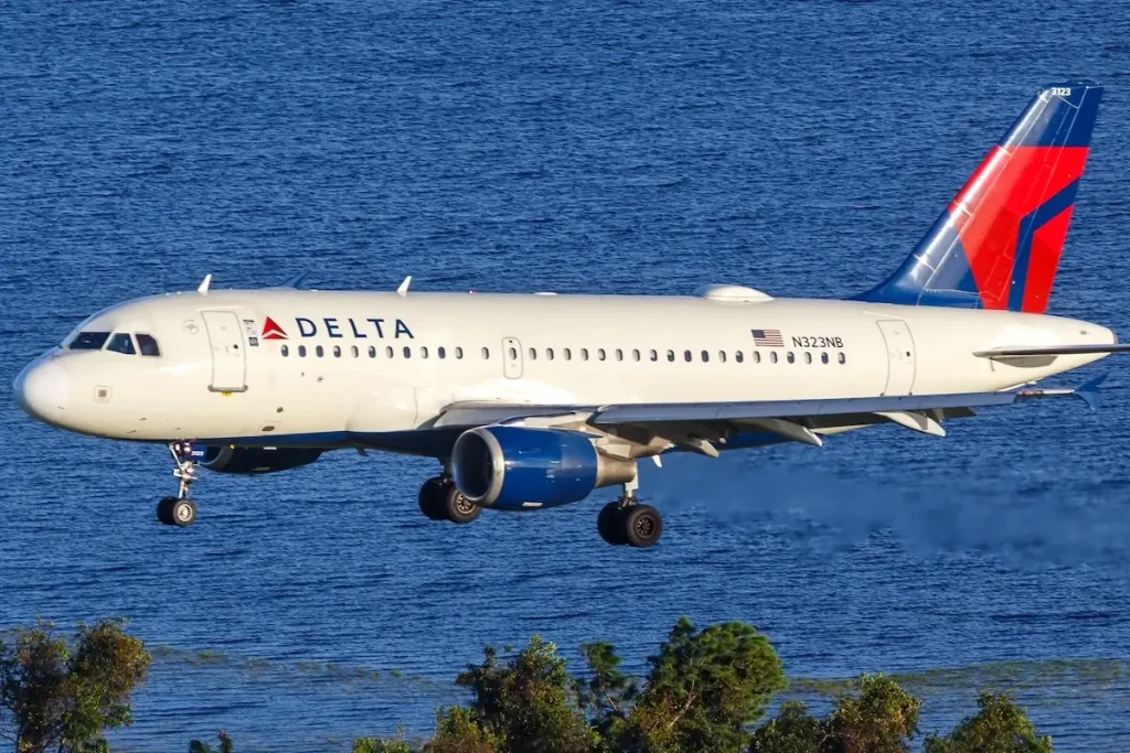 Aerial view photo of Delta Air Lines Airbus A319 airplane at Orlando Airport, United States.
