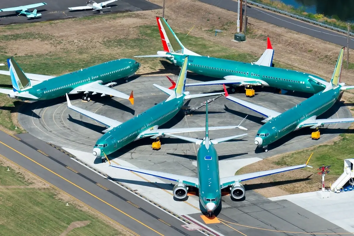Multiple engineless Boeing 737 MAX outside the assembly line parked at Renton Airport waiting for flight tests, painting and delivery.