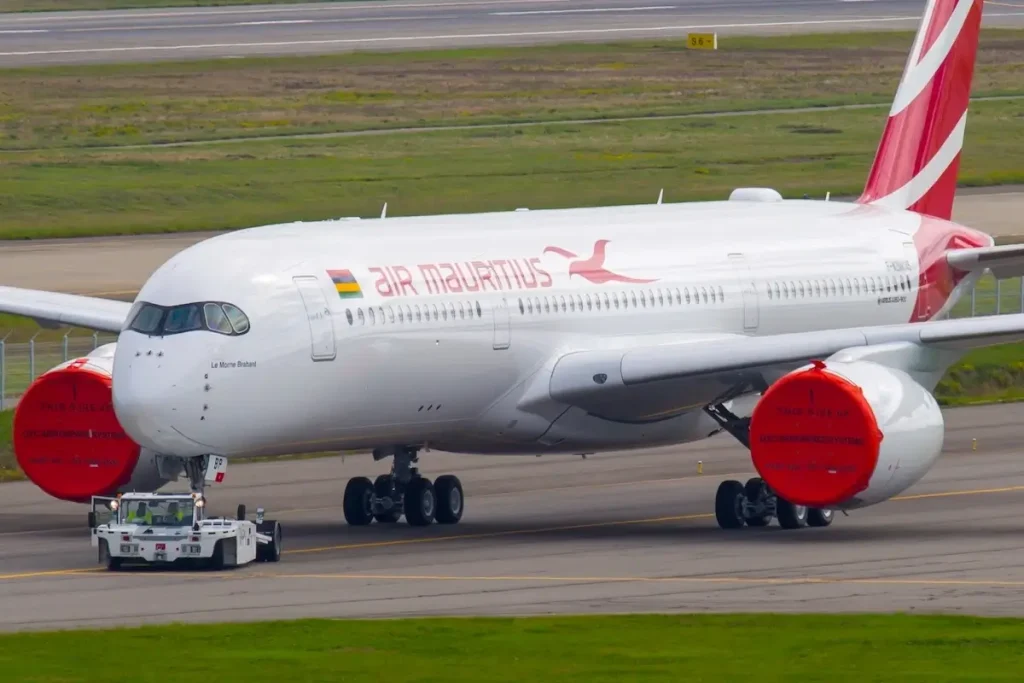 Passenger plane Airbus A350 XWB of Air Mauritius Airline. The aircraft is towed on the apron.