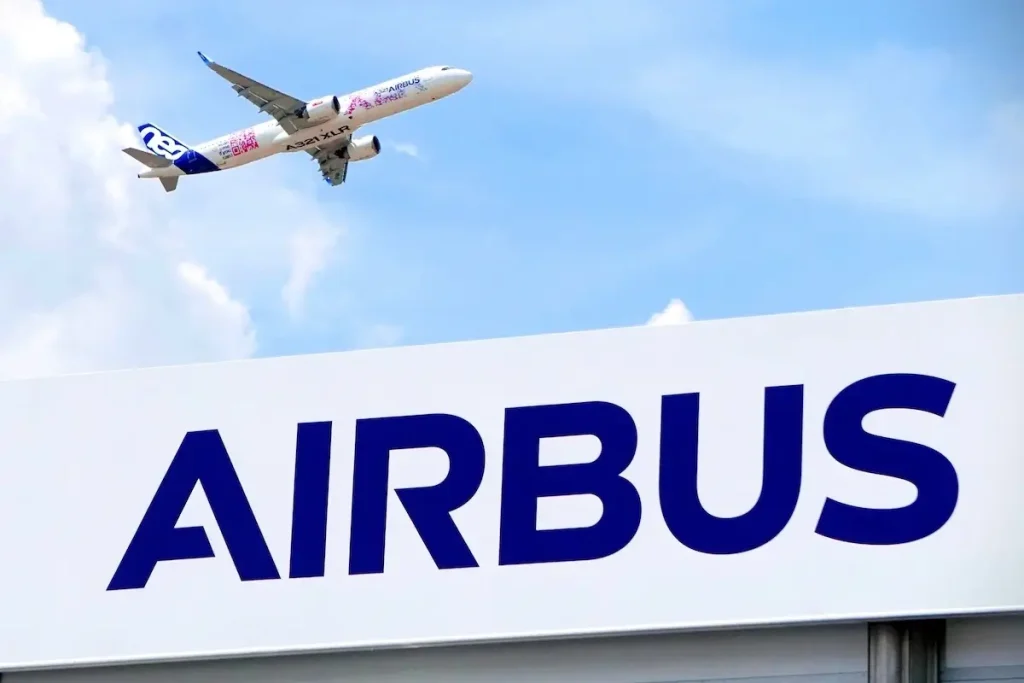 An Airbus A321XLR flight test vehicle performs a flying display behind the Airbus chalet at the 2023 Paris Airshow