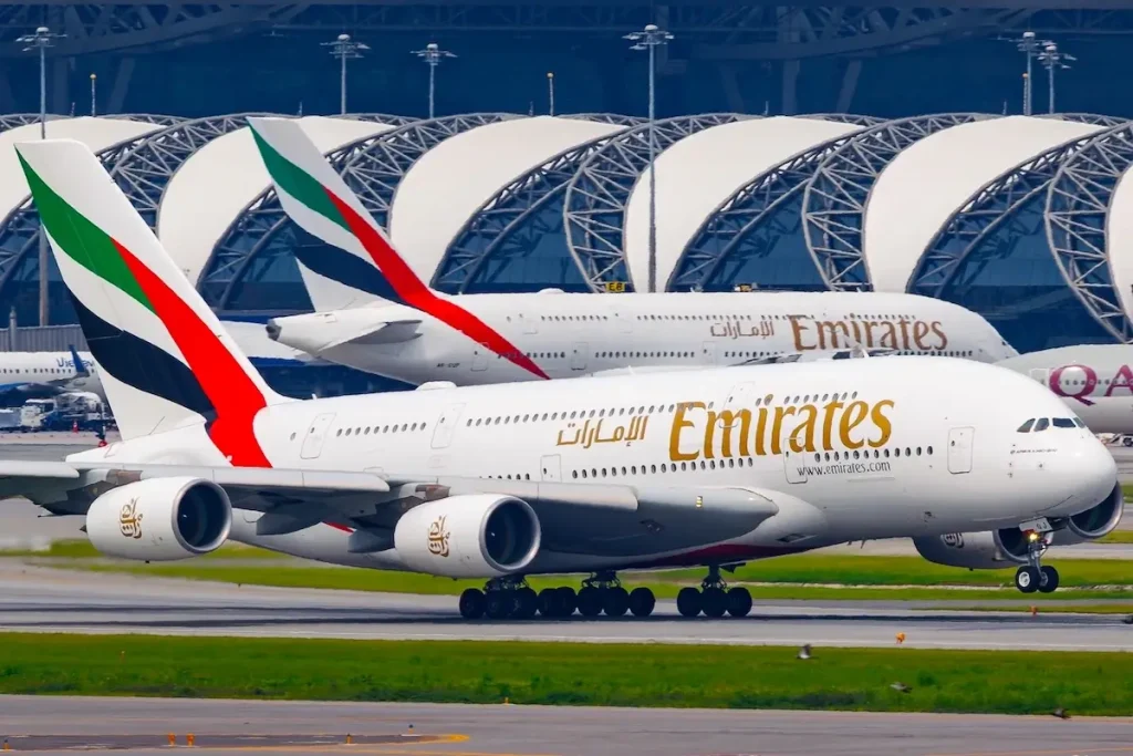 BANGKOK, THAILAND - AUGUST 21, 2024 : Emirates Airbus A380-800 reg.A6-EOJ takeoff from Suvarnabhumi Airport to destination with another Emirates Airbus A380-800 parking in background.