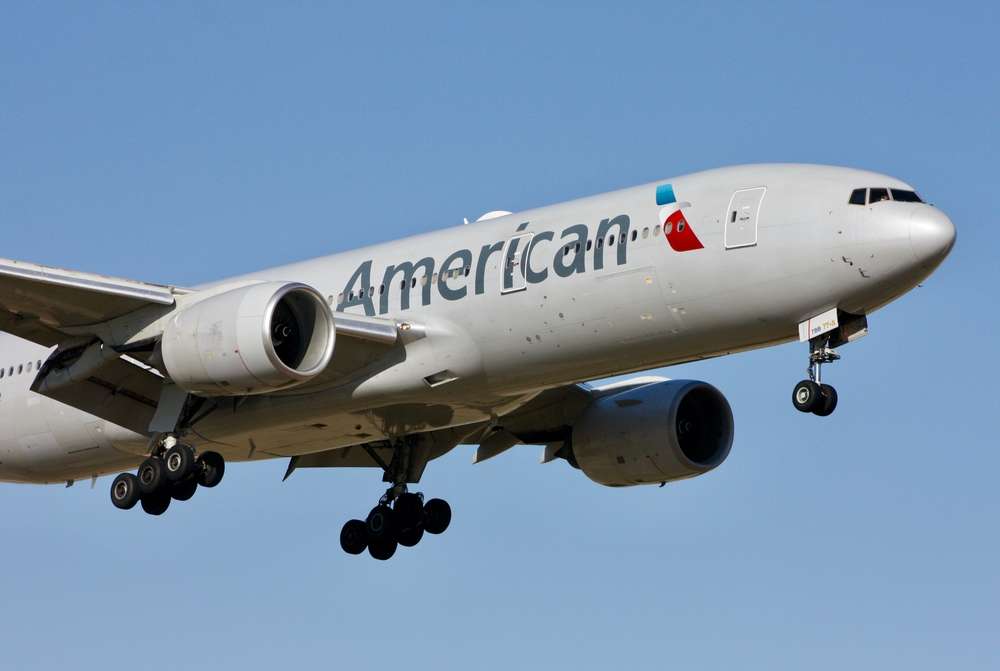 Irving, Texas – October 17 2024: A Boeing 777-200LR of American Airlines arriving at Dallas Fort Worth International Airport.