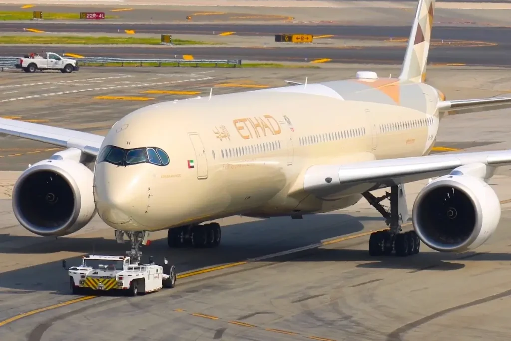New York, USA - 14 March, 2025: Etihad Airways Airbus A350-1000 and Boeing 787-9, 787-10 Dreamliner airplane at John F Kennedy (JFK) International Airport.