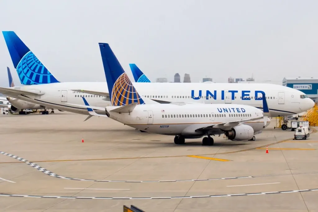 Newark, NJ - Jan 15 2023: A United Boeing 737 and Boeing 777 parked on the apron of Newark Liberty Airport