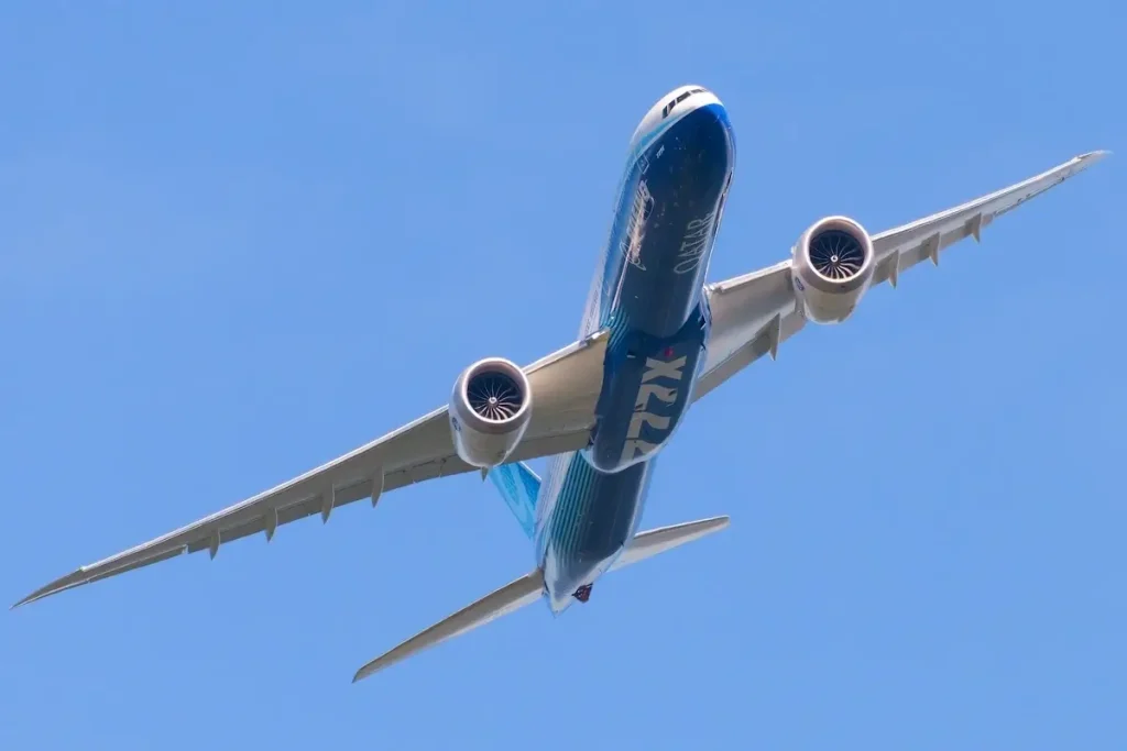 Duvall, WA, USA - August 11, 2023; Boeing 777-9 test bed aircraft turning isolated against blue sky with 777X logo