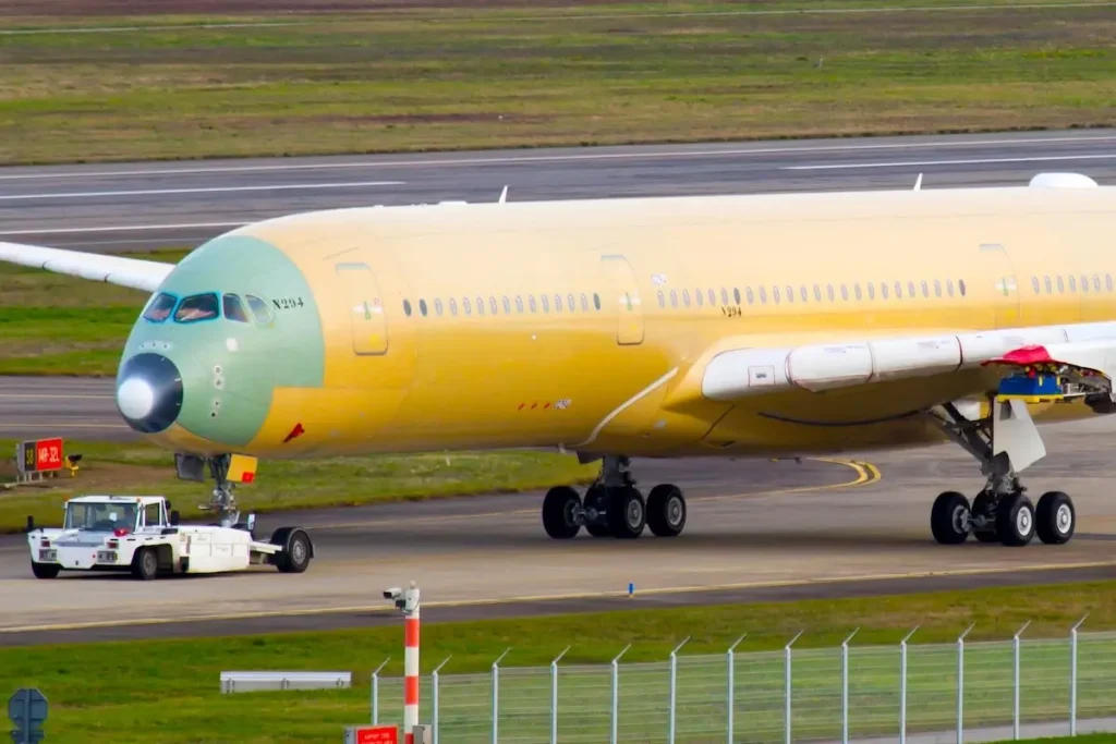 Toulouse / France - 12.17.2018. Airbus Plant, Blagnac Airport. Modern passenger aircraft Airbus A350 XWB of Singapore Airlines towed along the airport runway.