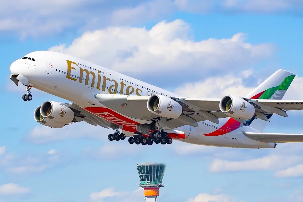 London, Heathrow, UK - June 28, 2025 - Emiratess, Airbus A380, Registration A6-EDF taking off with the tower in the background