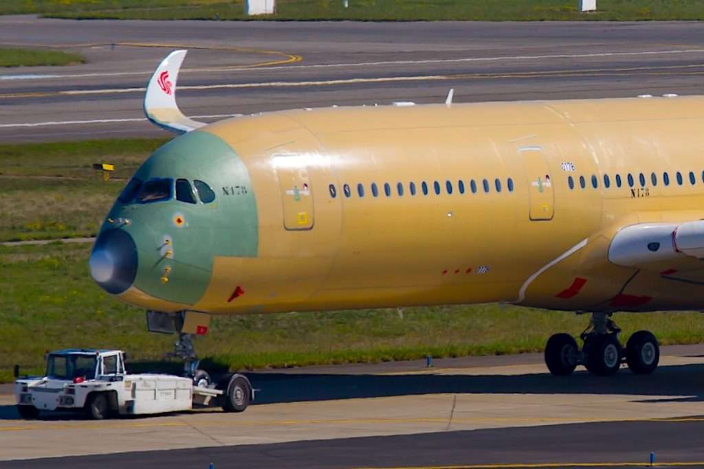 Blagnac Airport, Toulouse, France - 10.10.2017. Airbus Plant. Modern passenger aircraft Airbus A350 XWB of Air China B-1085 (Airbus A350 - MSN 178) are towed on the runway.