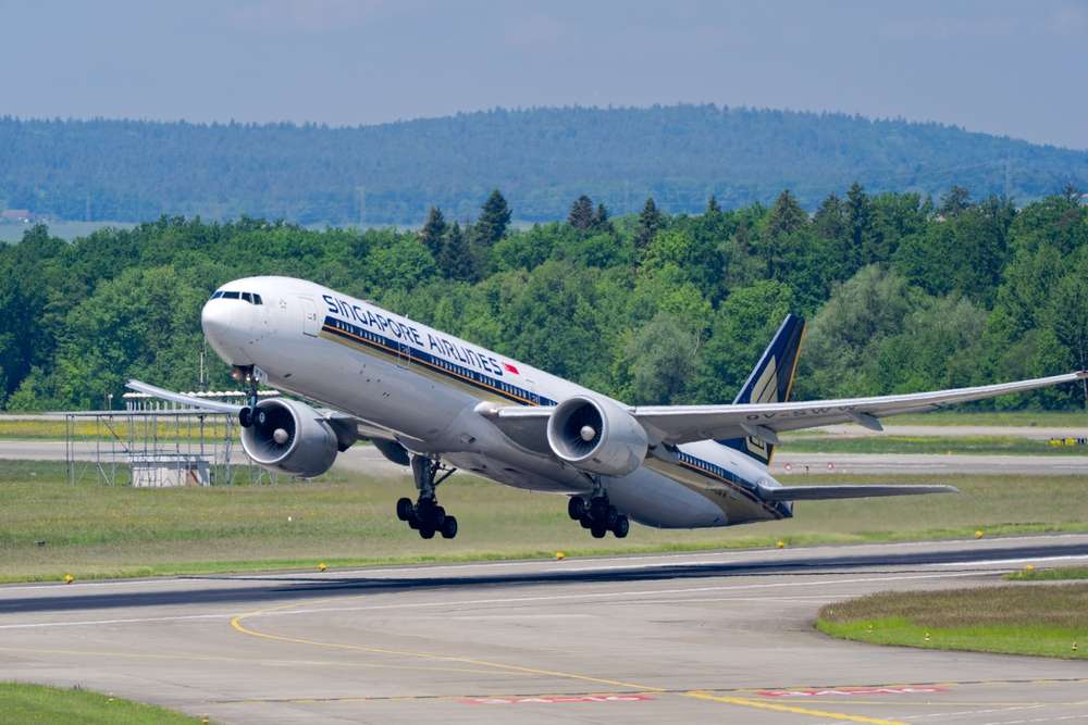 Passenger airplane Singapore Airlines Boeing 777-300ER registration 9V-SWW taking off from Swiss Airport Zürich Kloten on a sunny spring day. Photo taken May 10th, 2025, Zurich Kloten, Switzerland.