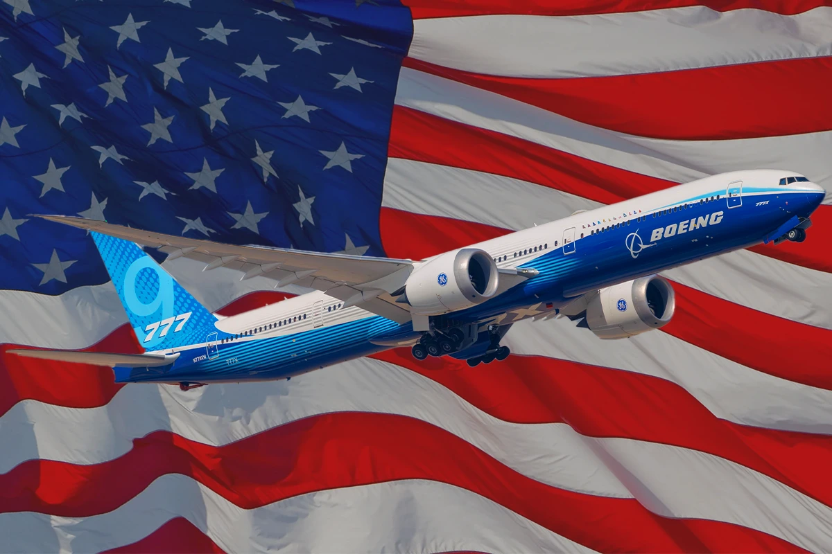 Dubai, United Arab Emirates - November 20 2025 - Boeing 777X widebody test aircraft captured in flight during a demonstration at Dubai Airshow 2025 with the USA flag in the background