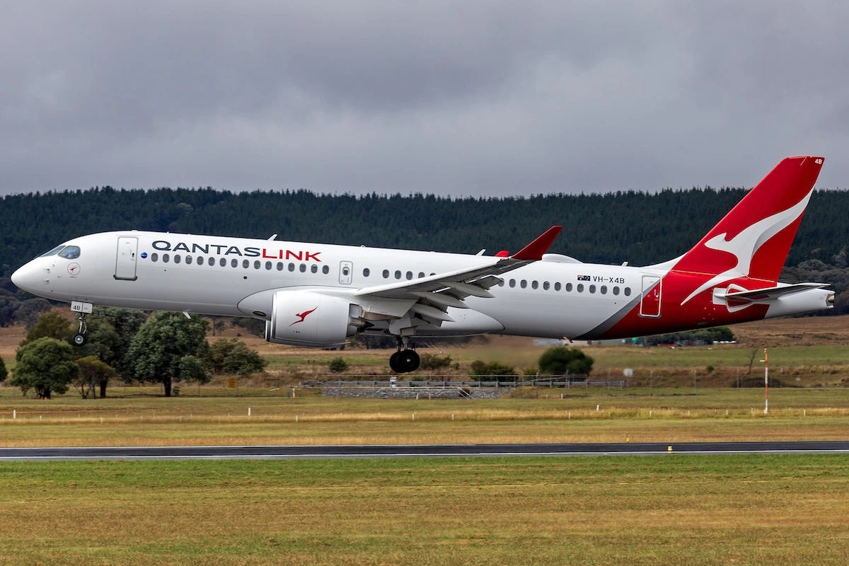 QantasLink, operated by National Jet Systems, (VH-X4B) Airbus A220-300 landing at Canberra Airport.