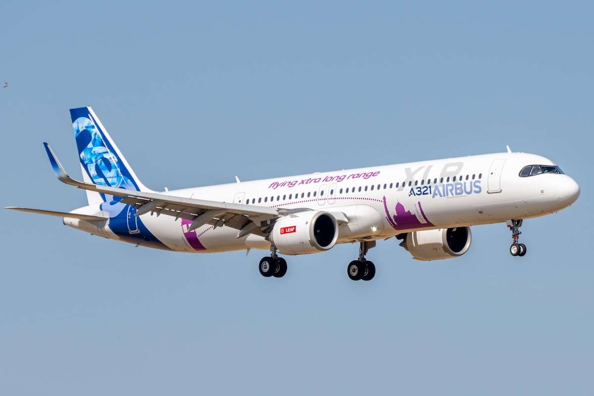 Moron, Spain - 3 May 23: An Airbus A321 XLR airplane in flight approaching for landing against a clear blue sky