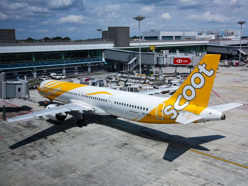 SINGAPORE - 3 JAN 2025: 11.51am. Scoot Airbus A321neo named "Just Wing It" has stopped at parking bay, T1, Changi Airport.