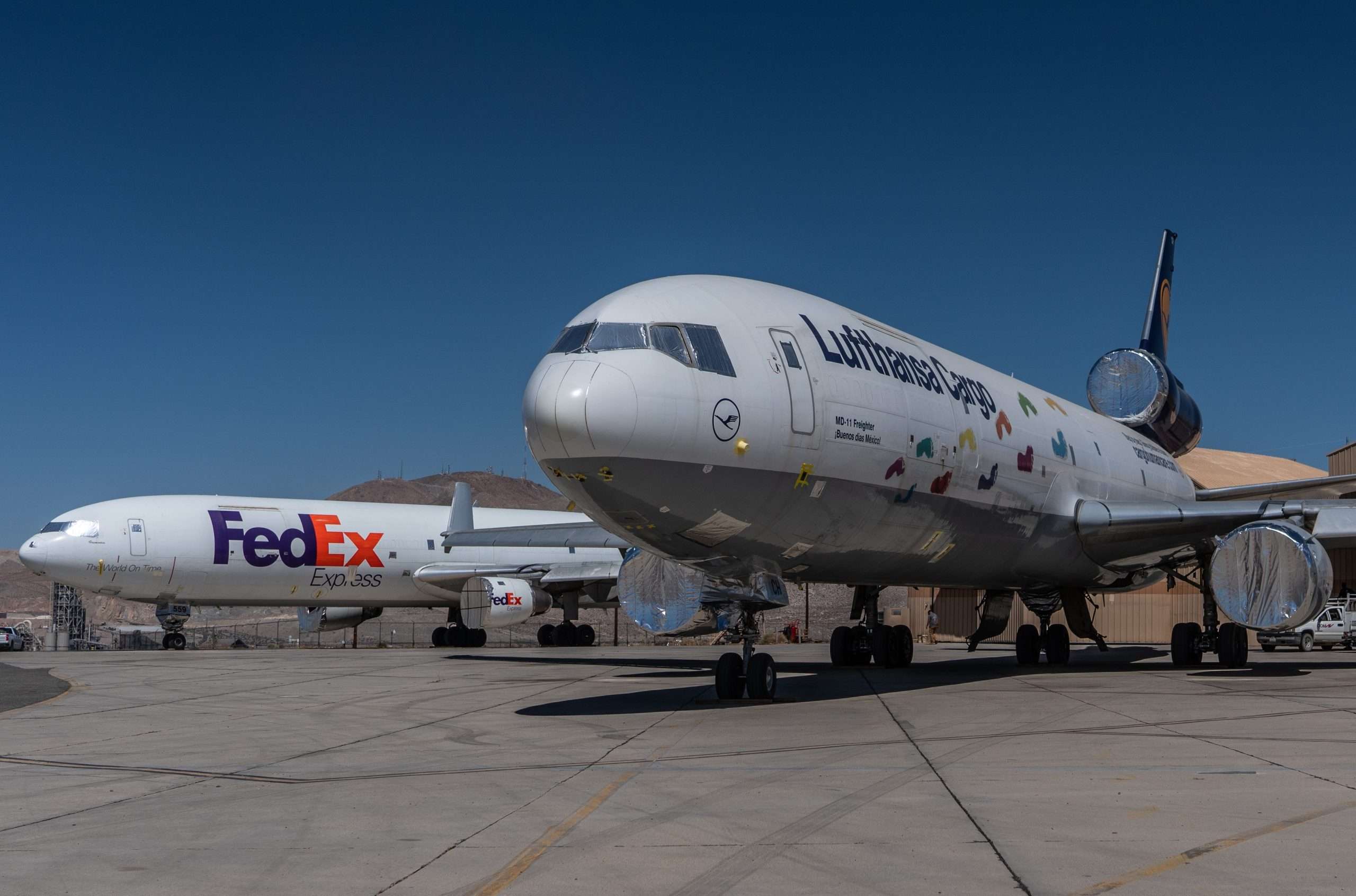 Victorville, California, USA, June 2021, Southern California logistics airport, aka as Victorville Airport, Lufthansa and FEDEX McDonnell Douglas MD-11cargo airplanes, stored due to coronavirus
