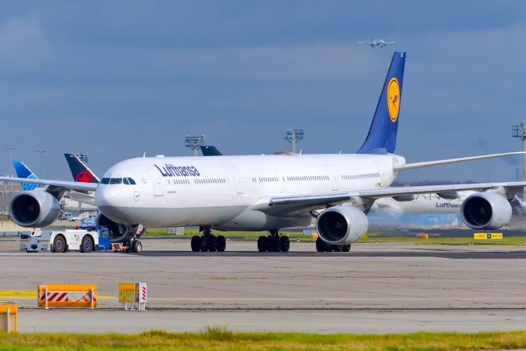 A Lufthansa Airbus A340-600 pushes back from Frankfurt Airport