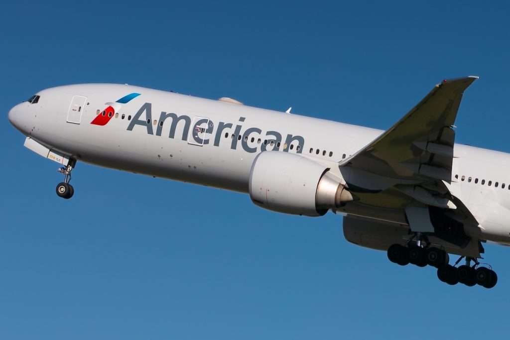 London, Heathrow, UK, 15 October, 2023 - American Airlines, Boeing 777 taking off in a clear blue polarised sky