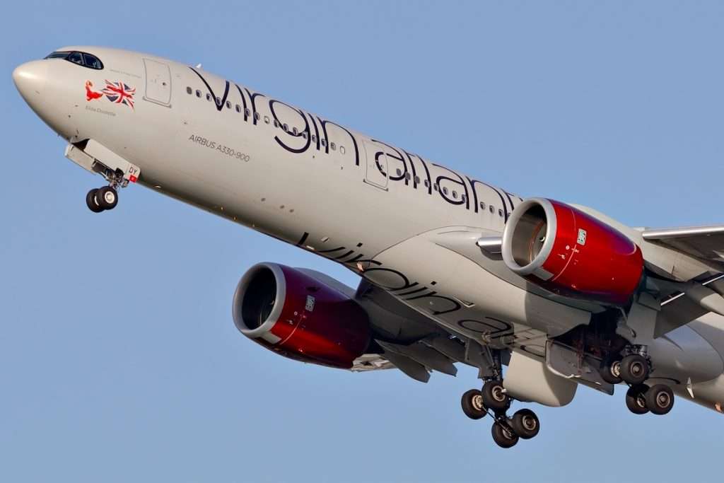 Virgin Atlantic Airbus A330neo taking off into a clear pale blue sky