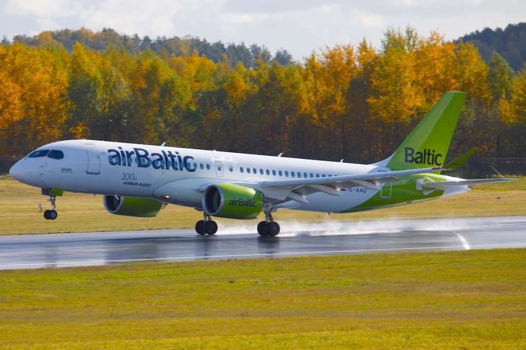 Vilnius, Lithuania - October 9, 2022: Airbaltic Airbus A220-300 YL-AAU landing at VNO Vilnius International Airport