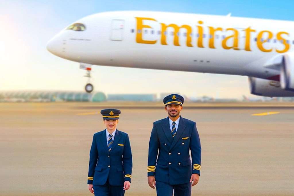 Emirates pilots in front of an Airbus A350 departing