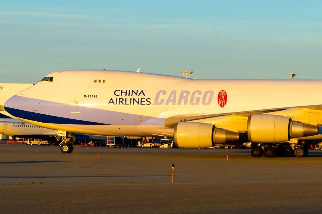 Anchorage, AK / USA - September 12 2018: Airside view China Airlines Cargo Boeing 747 freighter taxiing during sunset in Alaska.