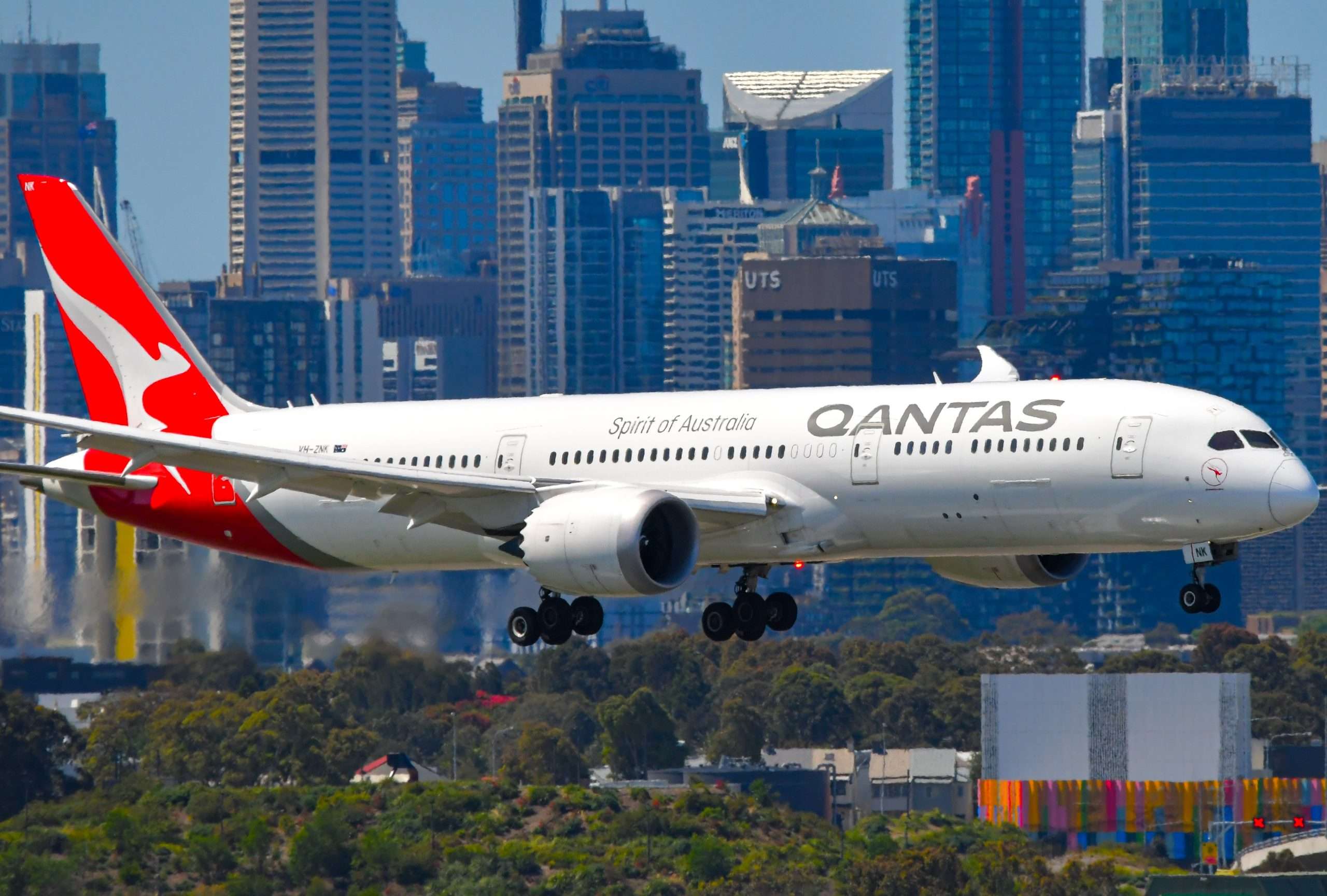 Sydney, NSW, Australia – October 25, 2022: Qantas Boeing 787-9 Dreamliner approaching Sydney Airport with city skyline in background