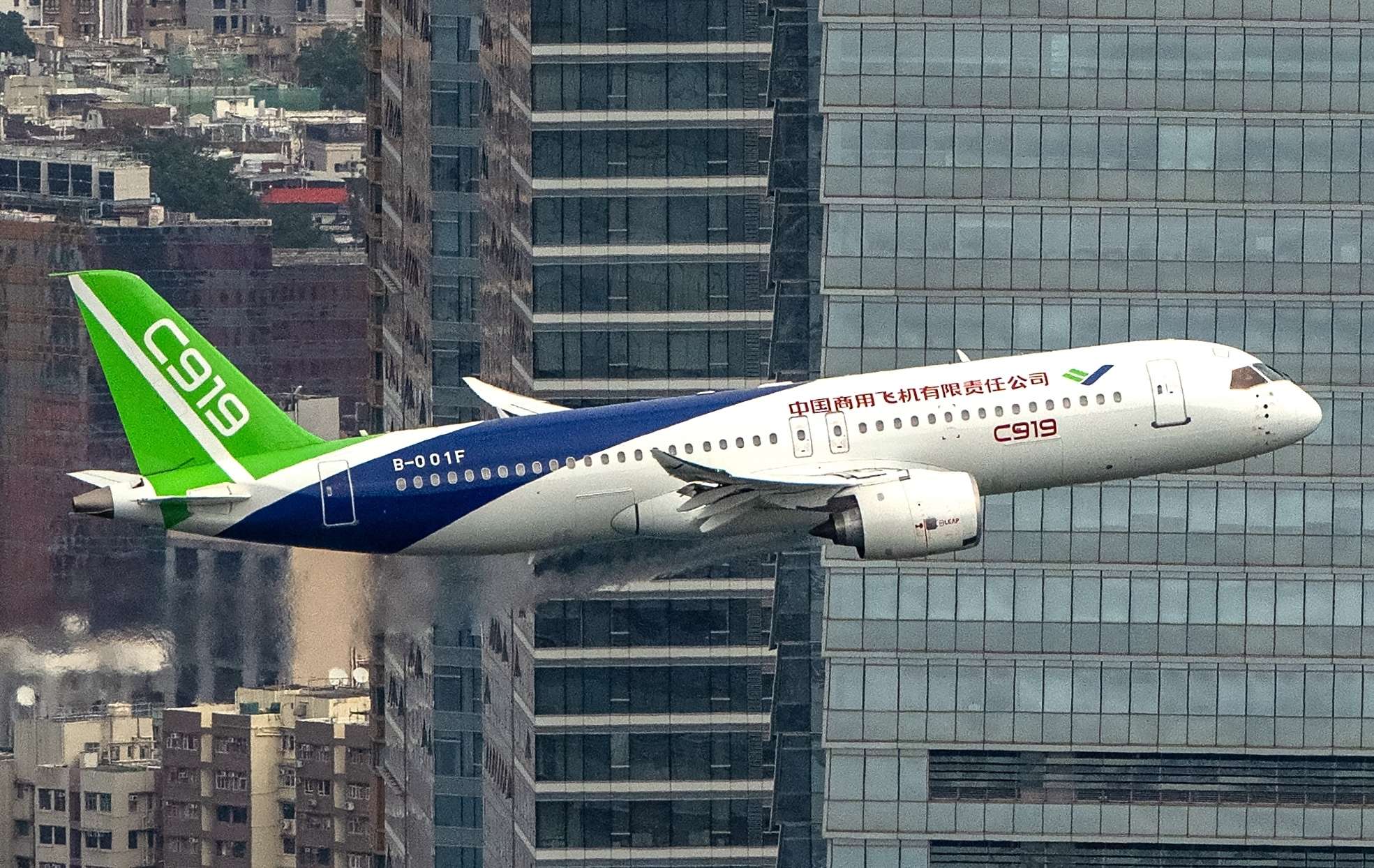 C919 aircraft, one of the new passenger jets made in China, conducts a flight demonstration over Victoria Harbour