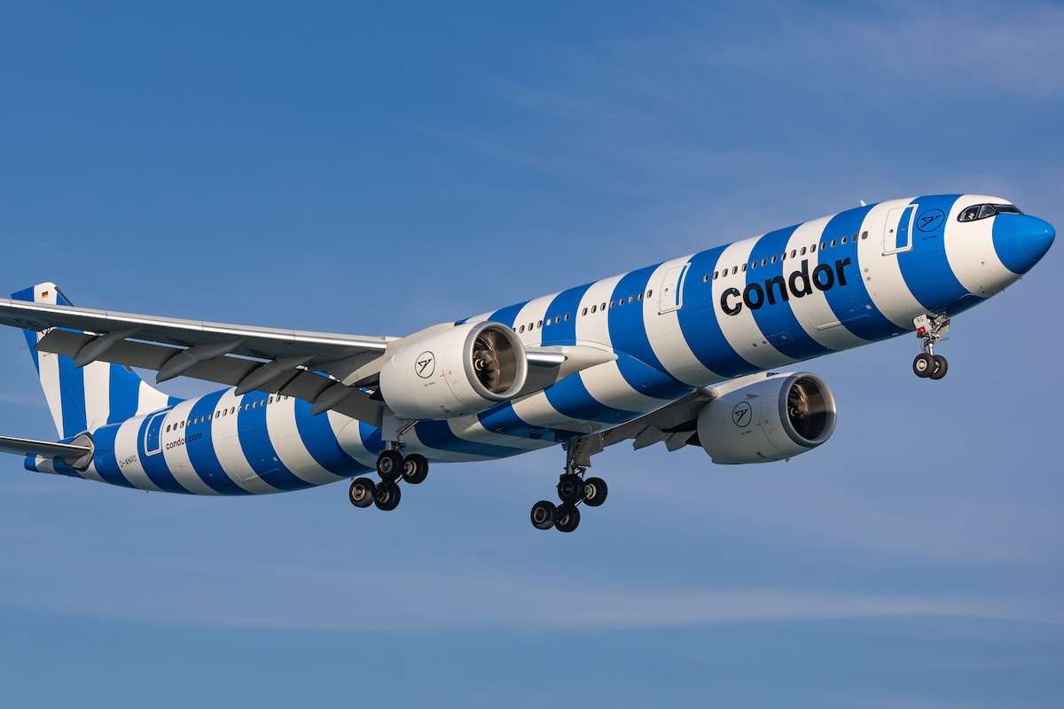 Condor Airbus A330-941 aircraft in blue striped “Sea” livery (D-ANRG) on final approach for landing at Phuket International Airport.
