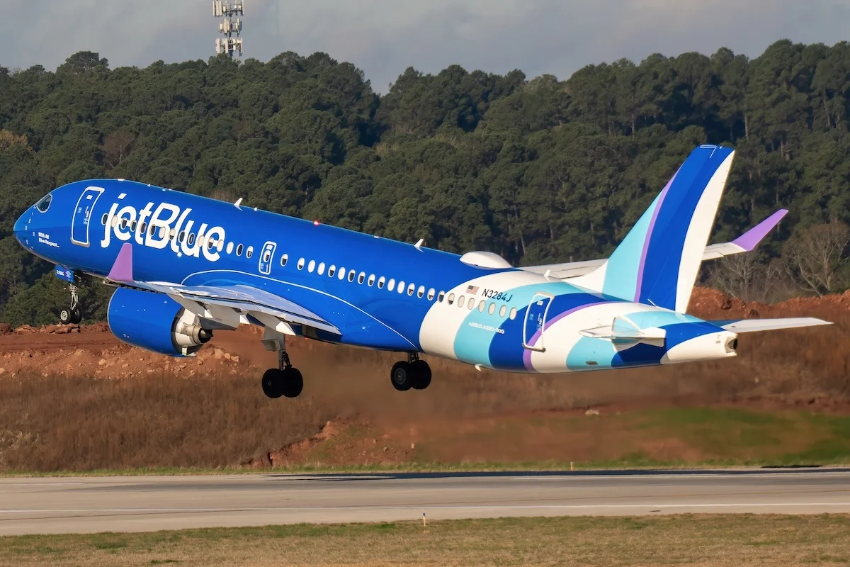 A JetBlue Airbus A220-300 passenger aircraft departs from Raleigh-Durham International Airport