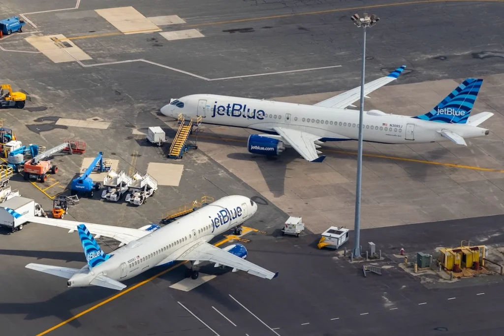 BOSTON, US - Sep 18, 2023: An aerial photograph of a pair of JetBlue Airways planes parked near hangars in Boston