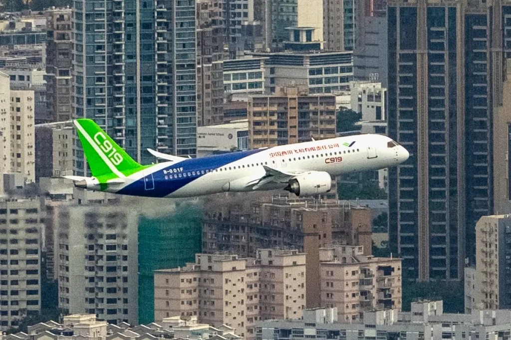 C919 aircraft, one of the new passenger jets made in China, conducts a flight demonstration over Victoria Harbour. The C919 visits Hong Kong for the first time