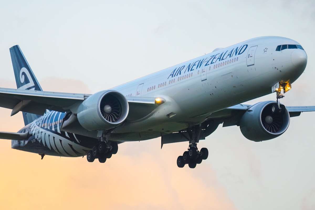 Auckland, New Zealand – September 10 2025: Air New Zealand Boeing 777 flying to Auckland International Airport at sunset.
