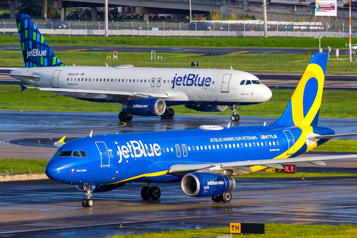 JetBlue Airways Airbus A320 airplane with JetBlue Honors our Veterans special livery at San Juan airport in Puerto Rico.
